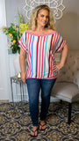 This vibrant, raspberry striped top is so stunning! This versatile neckline can be worn completely or partially off the shoulder allowing you to individually decide what looks best on your body! We love the great amount of stretch this blouse provides in addition to the bloused hem and dolman sleeves. This top looks great with a variety of denim bottoms or shorts!   95% Rayon 5% Spandex  Color: Raspberry Striped