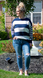 Everybody needs that classic go-to sweater that can be worn with your favorite pair of jeans! This mid-weight blue and white striped sweater fits the bill and is perfect for staying warm this fall/winter! It features a classic blue and white stripe detail pattern, round neckline and relaxed fit…perfect for relaxing at home or brunch with the girls! Pair with your favorite denim or leggings and booties for a fresh fall look!   100% Acrylic  Color: Blue and White Stripe